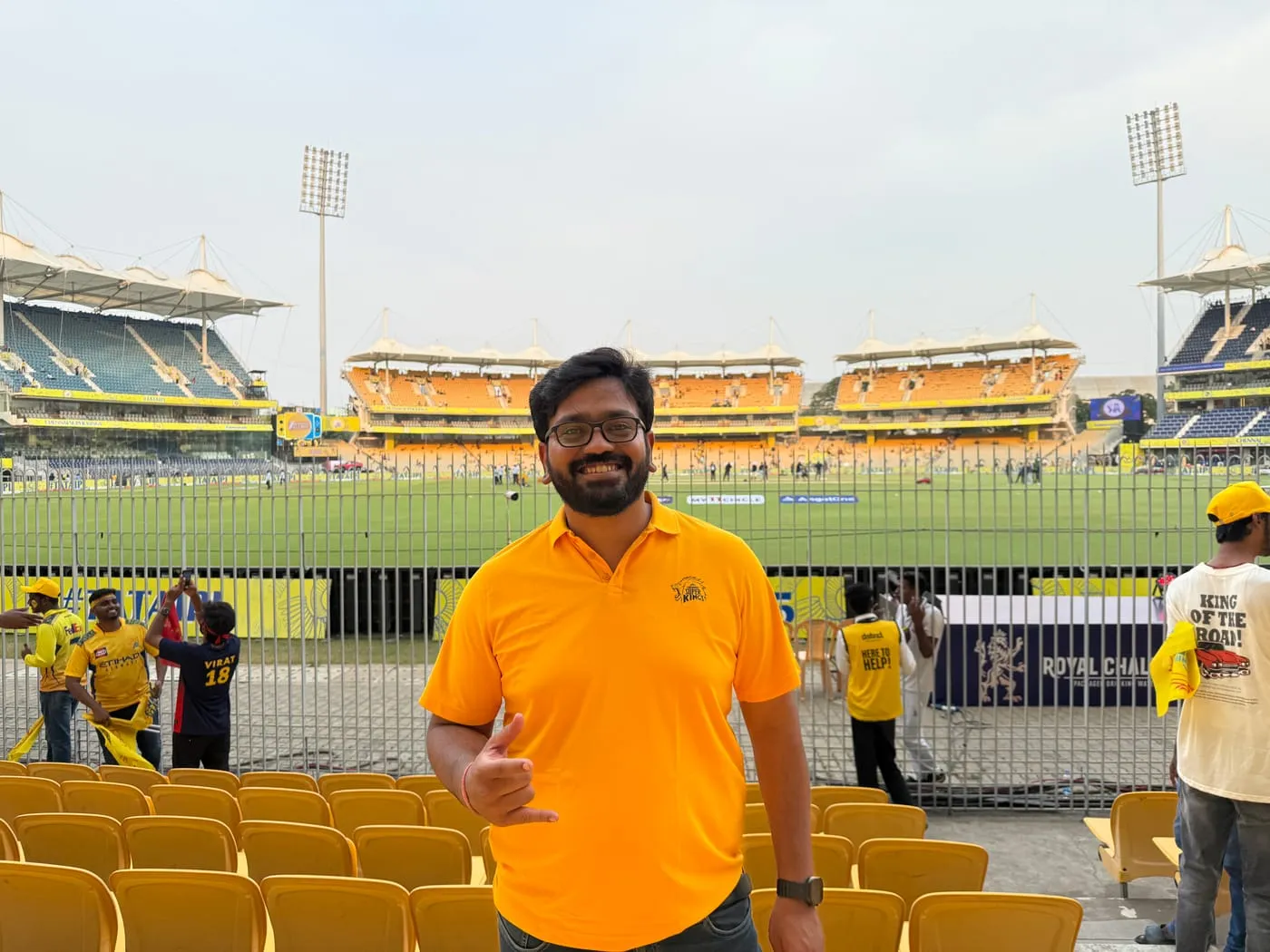 Shishir at a cricket stadium wearing a Chennai Super Kings shirt